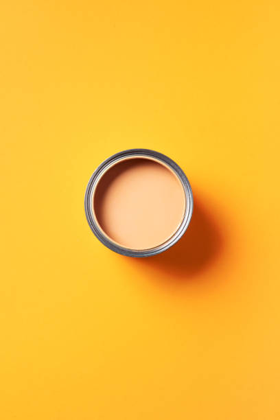 istock Open paint can with on trendy yellow background. Top view, copy space. Appartment renovation, repair, building and home design concept. 1180991020