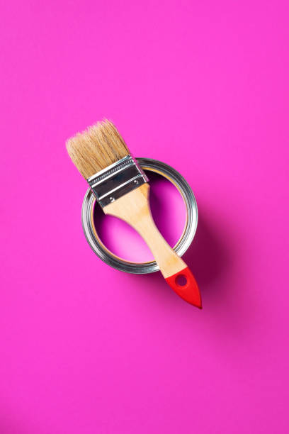 istock Brush and open paint can with on trendy yellow background. Top view, copy space. Appartment renovation, repair, building and home design concept. 1180991037