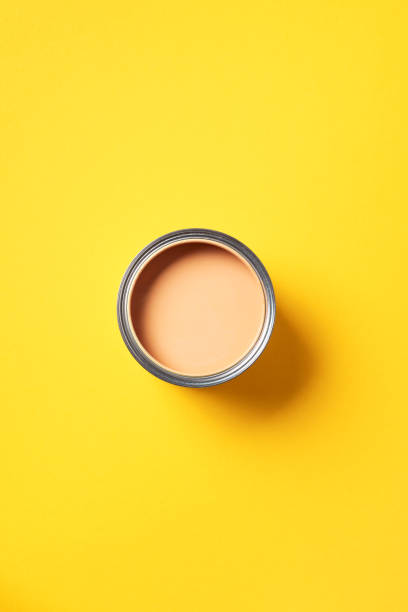 istock Open paint can with on trendy yellow background. Top view, copy space. Appartment renovation, repair, building and home design concept. 1180991064