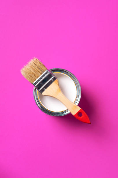 istock Brush and open paint can with on trendy yellow background. Top view, copy space. Appartment renovation, repair, building and home design concept. 1180991087