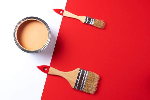 istock Wooden paint brushes, open paint can on trendy red and white background. Top view, copy space. Appartment renovation, repair, building and home design concept. 1180991212