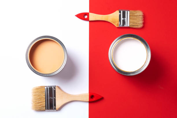 istock Wooden paint brushes, open paint cans on trendy red and white background. Top view, copy space. Appartment renovation, repair, building and home design concept. 1180991225