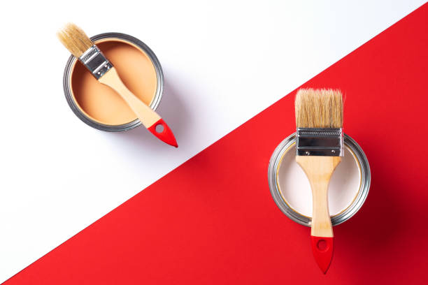 istock Wooden paint brushes, open paint cans on trendy red and white background. Top view, copy space. Appartment renovation, repair, building and home design concept. 1180991229