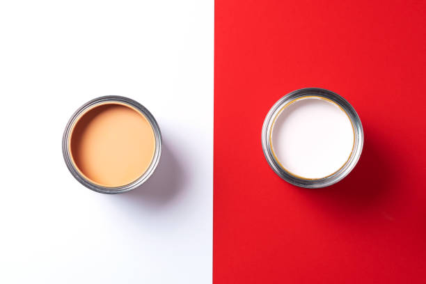 istock Open paint cans on trendy red and white background. Top view, copy space. Appartment renovation, repair, building and home design concept. 1180991230