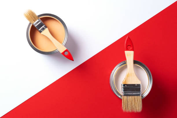 istock Wooden paint brushes, open paint cans on trendy red and white background. Top view, copy space. Appartment renovation, repair, building and home design concept. 1180991238