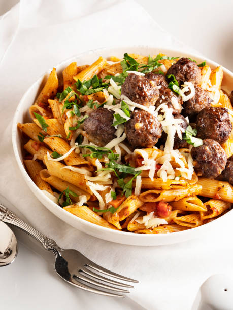 pasta and meatballs, Penne pasta with meatballs in tomato sauce, Penne Pasta with meatballs Italian Culture, Appetizer, meatball, Beef, Lunch, Pasta, Penne, Meal,food,Macaroni,Crockery,food and drink, dinner penne meatballs stock pictures, royalty-free photos & images