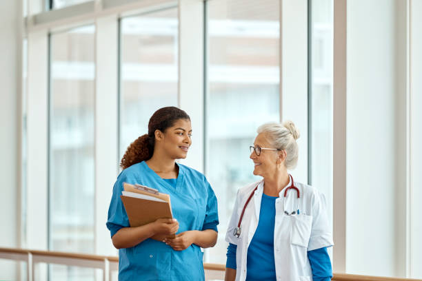 istock Medical Professionals Walking In Corridor 1180992454