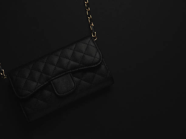 istock Black leather bag with golden chain 1180993659
