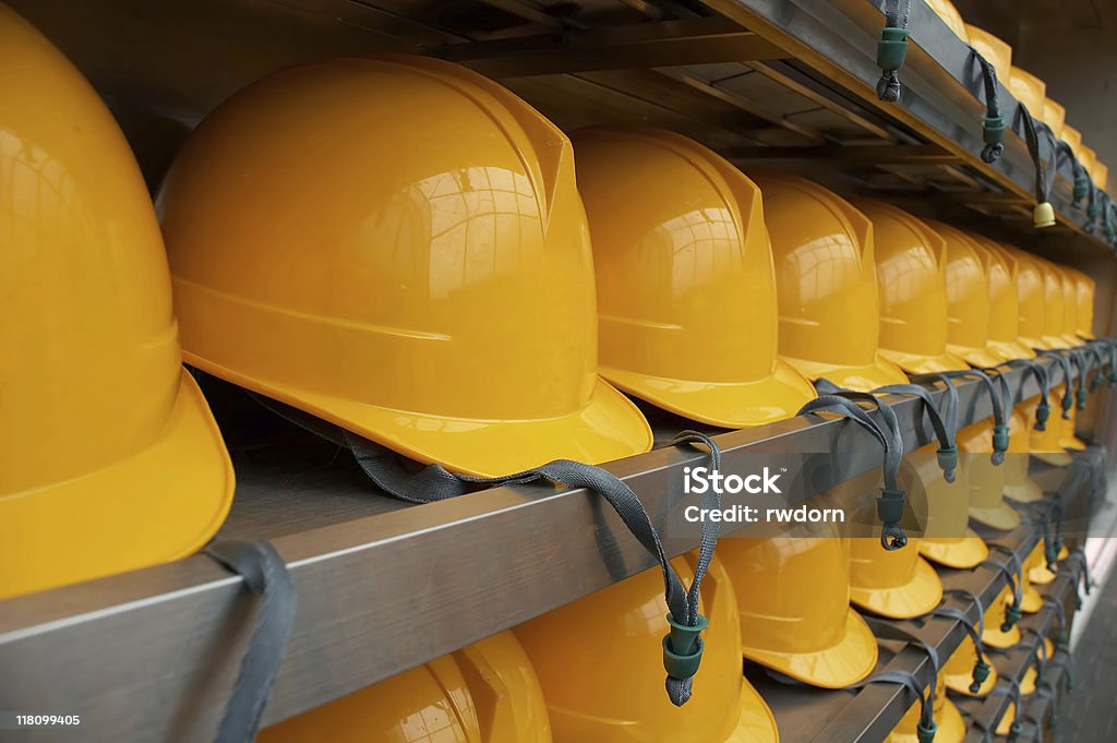 Bright Yellow Hardhats - closeup  Occupational Safety And Health Stock Photo