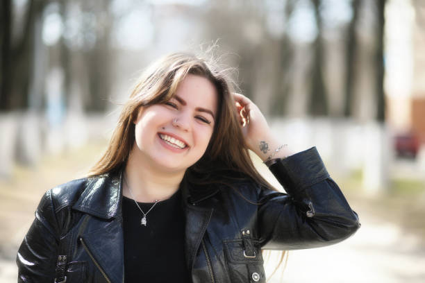 istock Cute girl in an autumn park 1180994720