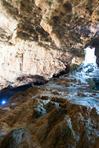 istock View of the waterfall from the cave inside 1180996133