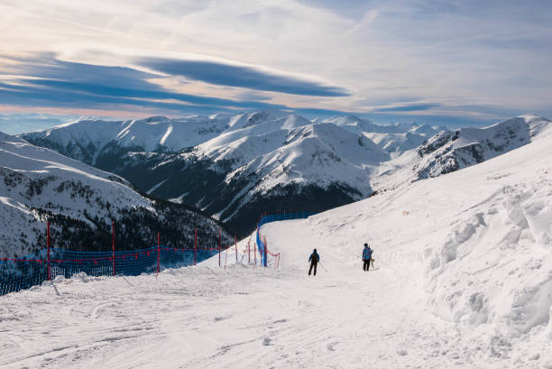 istock Winter view from Kasprowy Wierch Peak on ski slope and Swinca Peak. 1180996975