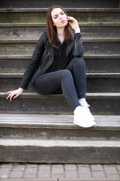 istock Girl on a walk through the spring city 1180997649