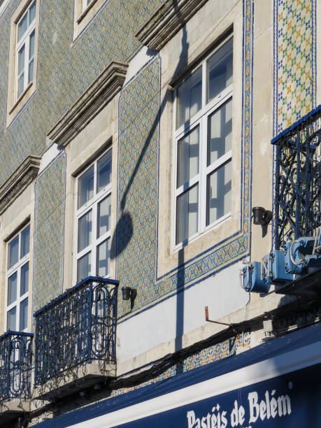 view of  the  typical facade of the building with tiles (azuleios)  wall  of the famous pastry shop "pasteis de belem" of lisbon - pastel de nata ilustrações imagens e fotografias de stock