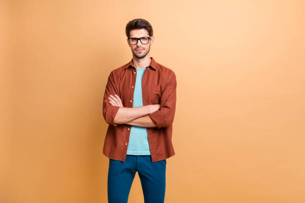 istock Portrait of his he nice attractive content successful serious brunet guy executive experienced finance assistant folded arms isolated over beige color pastel background 1181005778