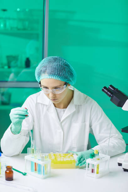 istock Young Woman Working in Medical Lab 1181006475