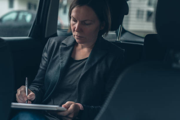 istock Businesswoman doing paperwork and analyzing business report 1181006524