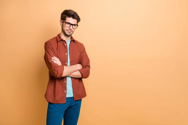 istock Portrait of his he nice attractive content successful focused brown-haired guy executive experienced finance director shark folded arms isolated over beige color pastel background 1181007862