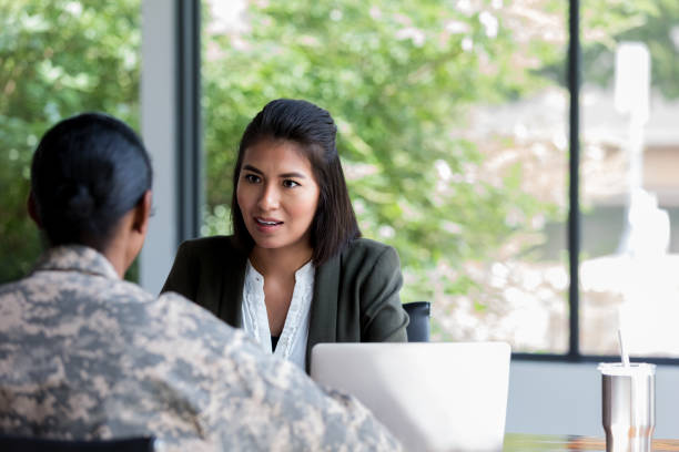 istock Female military veteran talks with counselor 1181008194