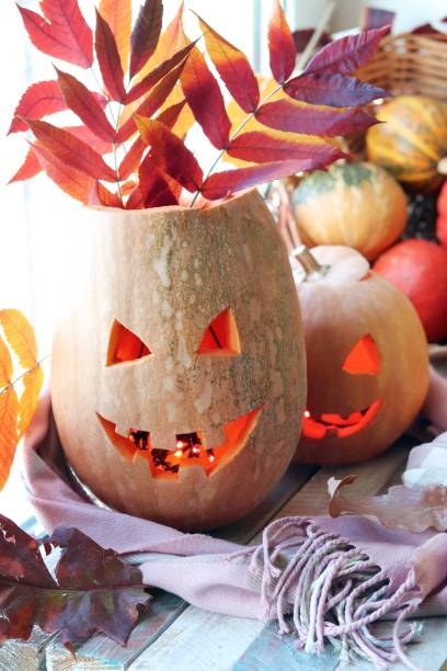 istock Halloween composition from jack-o-lanterns, a warm scarf, pumpkins, illuminations 1181009188