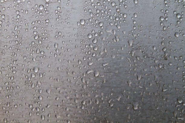 istock Raindrops on stell wall detail 1181010878