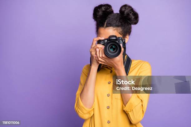 Photo Of Amazing Dark Skin Lady Holding Photo Digicam In Hands Photographing Foreign Sightseeing Abroad Wear Yellow Shirt Trousers Isolated Purple Color Background Stock Photo - Download Image Now