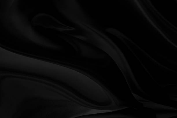 istock Black fabric texture that is black silk background with beautiful soft blur pattern. 1181011846