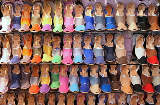 Ciutadella, Menorca, Spain - August 13, 2018 : Traditional Menorcan abarca sandals at Mibo shop display.