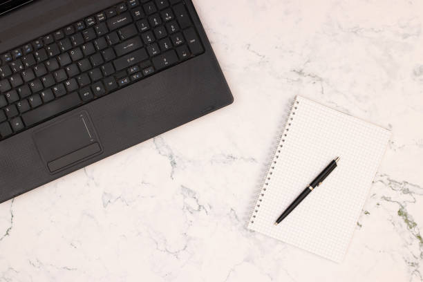 istock Top view of office table. Office supplies on the table 1181019929