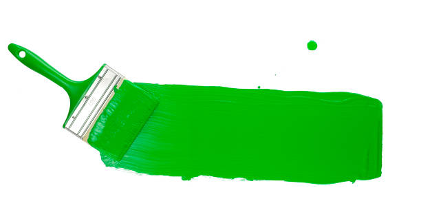 istock Paint Brush Stroke Across Page with bright green paint. Isolated on White Background. 1181020092