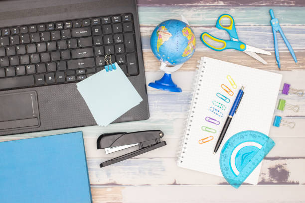 istock Top view of office table. Office supplies on the table 1181020241