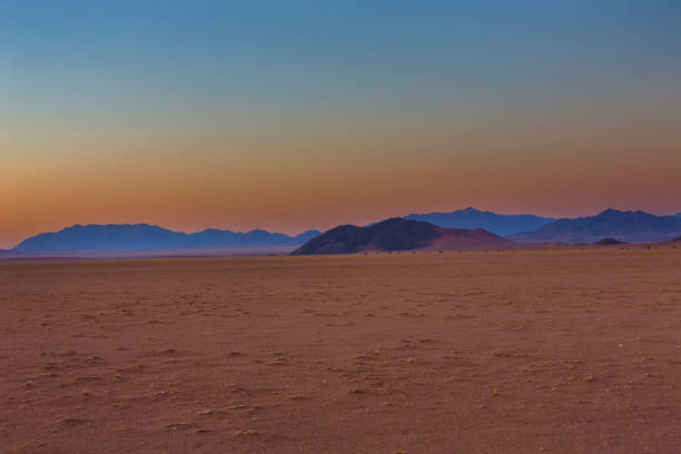 istock Blue mountains after sunset in the desert 1181025127