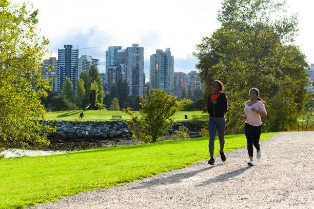 istock Fit women jogging in a park 1181025478
