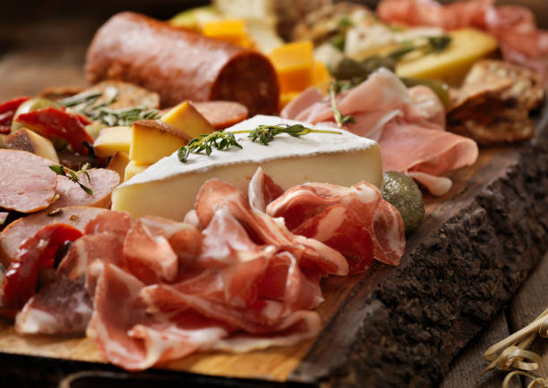 Charcuterie Board Charcuterie Board prosciutto brie stock pictures, royalty-free photos & images
