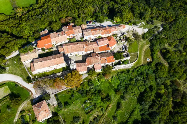 Old town of Hum on the hill, beautiful traditional architecture in Istria, Croatia, aerial view from drone
