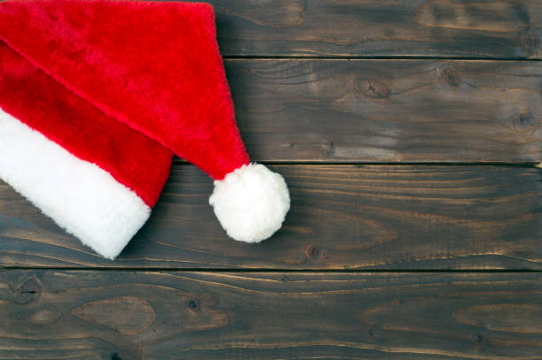 istock Christmas santa hat on a wooden background with copy space 1181030921