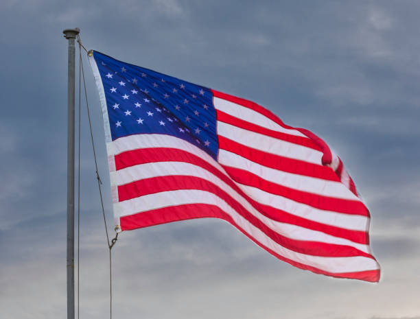 istock American Flag waving in the wind 1181030942