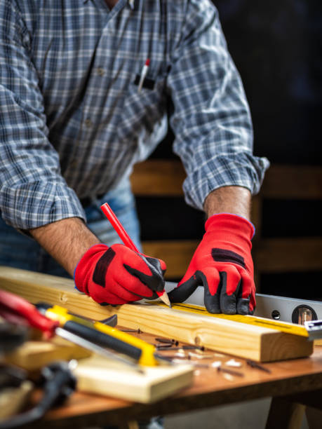 istock Craftsman at work on wooden boards. Carpentry. 1181030992