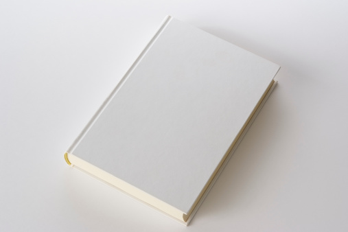 Isolated shot of white blank book on white background