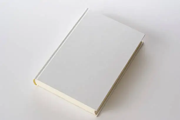 High angle view of white blank book isolated on white background.