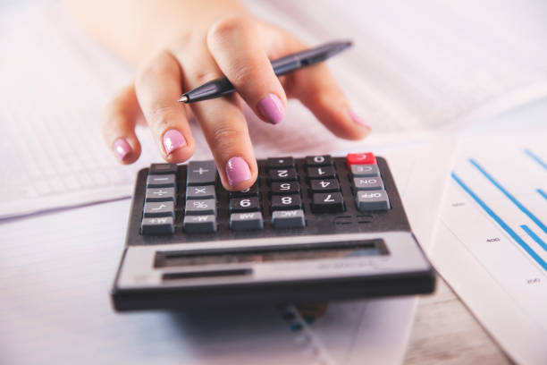 istock woman hand calculator and pen 1181032239