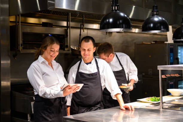 istock Hospitality team discussing bookings on a tablet 1181032273