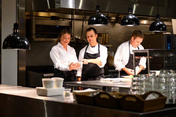 istock Hospitality team discussing bookings on a tablet 1181032307