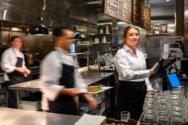 Server adding a new order with a tablet Waitress with a digital tablet. Foodservice and hospitality workers. Restaurant staff working. caterer photos stock pictures, royalty-free photos & images