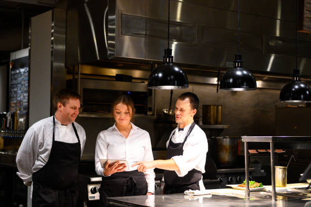 istock Hospitality team discussing bookings on a tablet 1181032614