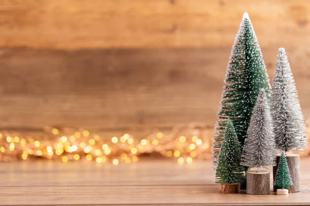 istock Colorful Christmas tree on wooden, bokeh background. 1181033831