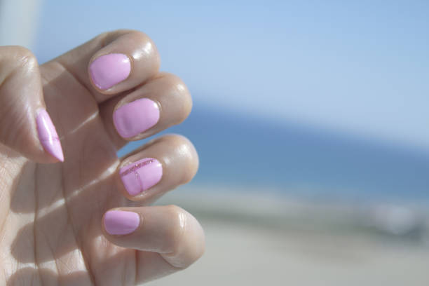 Semipermanent pink gel painted nails