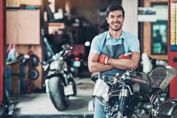 istock Happy motorcycle shop owner 1181035363