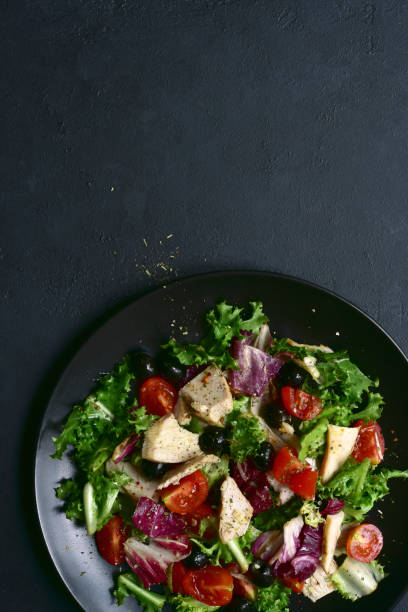 istock Vegetable salad with chicken and spicy citrus dressing. Top view with copy space. 1181037228