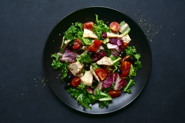 istock Vegetable salad with chicken and spicy citrus dressing. Top view with copy space. 1181037304